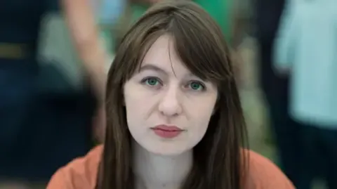 The acclaimed novelist claims she will not travel to the UK over legal concerns